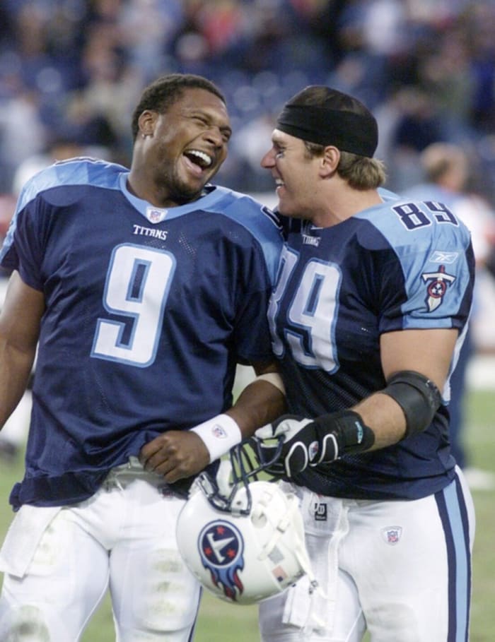 Tennessee Titans quarterback Steve McNair (9) and tight end Frank Wycheck (89) laugh with each other as they walk off the field after defeating the Jacksonville Jaguars 23 to 14 at the Nashville Coliseum Oct. 13, 2002. The win ended a four-game losing streak.